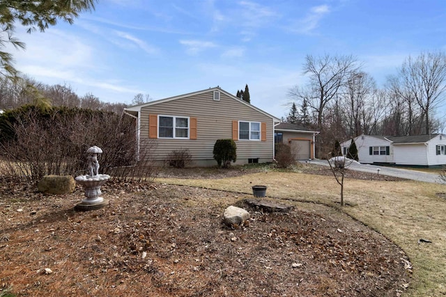 view of side of home with a garage