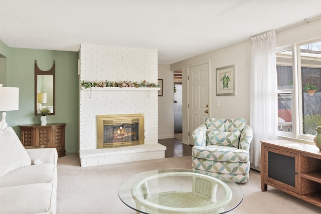 living area featuring carpet and a brick fireplace