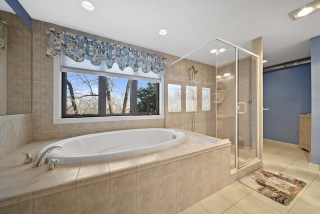 bathroom with tile patterned flooring, a garden tub, recessed lighting, and a stall shower