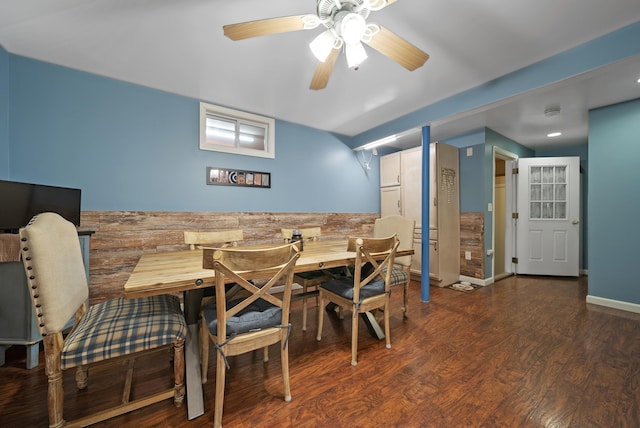 dining space with wood finished floors and ceiling fan