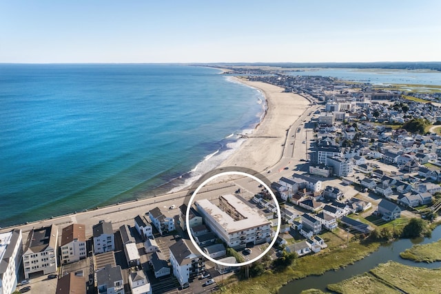 aerial view featuring a view of the beach and a water view