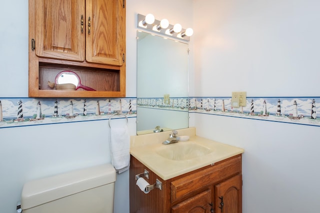 bathroom with toilet and vanity