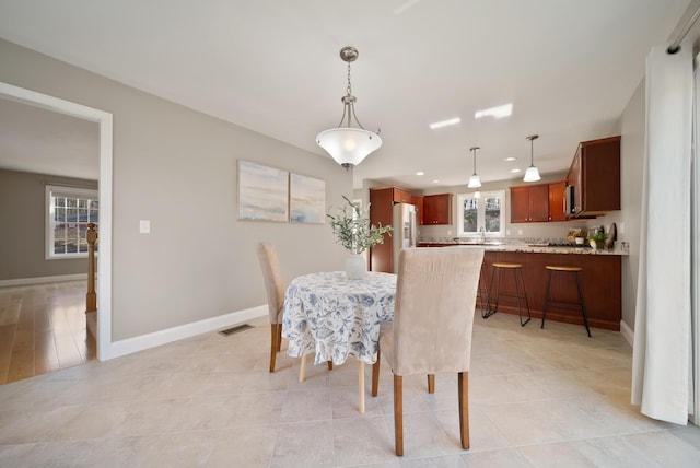 dining space featuring recessed lighting, visible vents, baseboards, and light tile patterned flooring