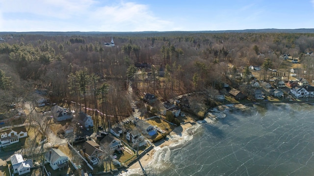 birds eye view of property featuring a wooded view and a residential view