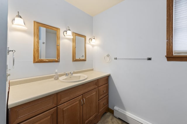 bathroom with a baseboard heating unit and vanity