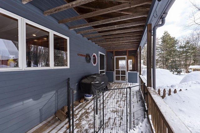 snow covered deck with area for grilling