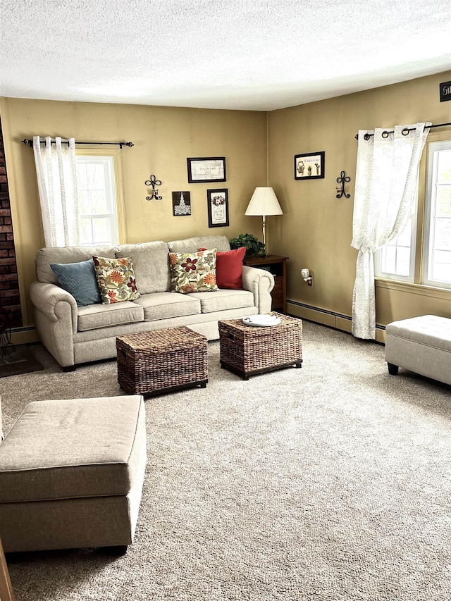 carpeted living area with a baseboard radiator, baseboards, and a textured ceiling