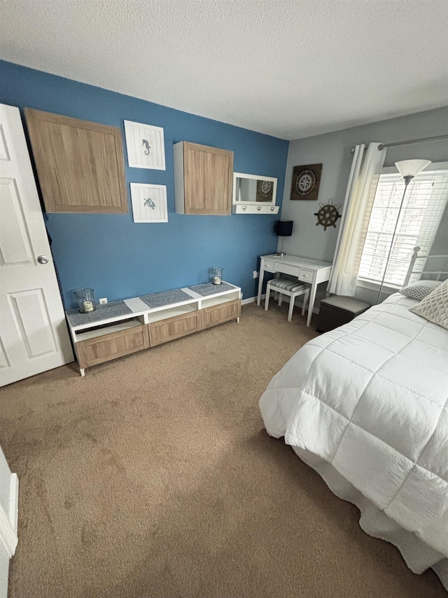 carpeted bedroom featuring a textured ceiling