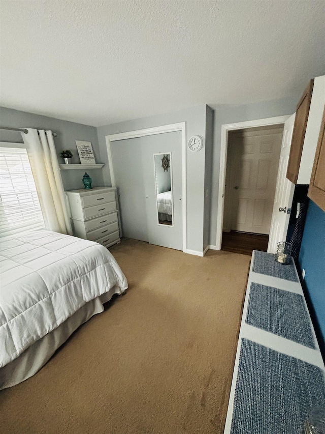 carpeted bedroom with a textured ceiling