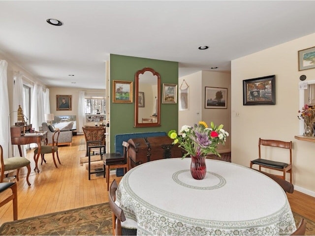 dining room with recessed lighting and hardwood / wood-style floors