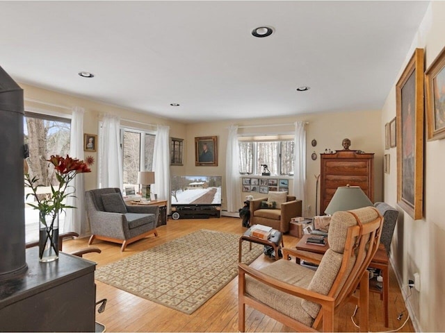 living area with recessed lighting and light wood-type flooring