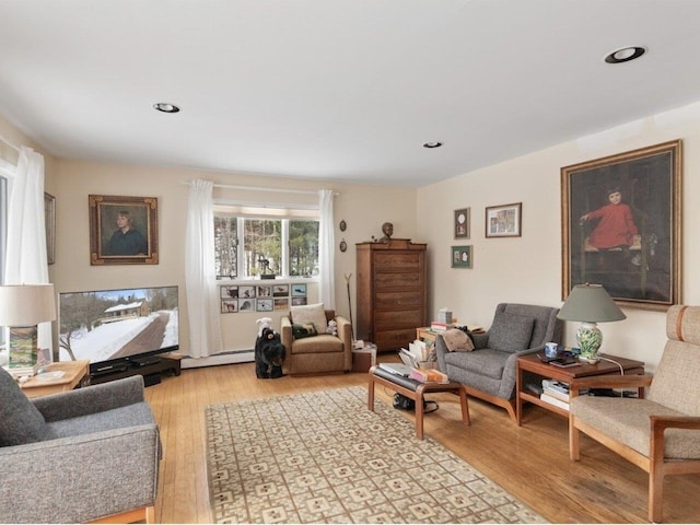 living room with light wood-style flooring and recessed lighting