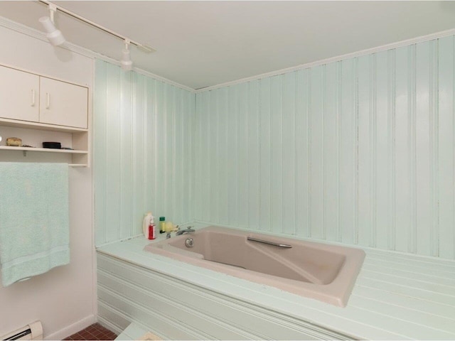 bathroom featuring a bath and a baseboard radiator