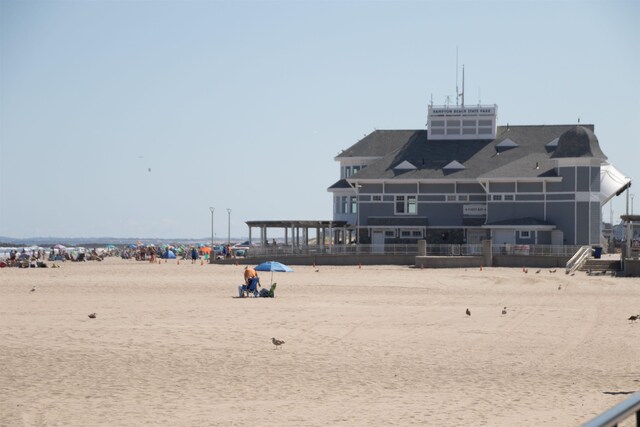 view of community with a beach view