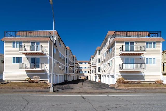 view of building exterior featuring driveway and a garage