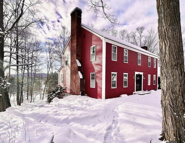 exterior space featuring a chimney