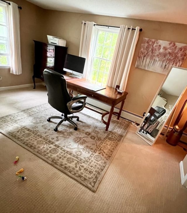 carpeted home office with baseboards and a healthy amount of sunlight