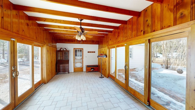 sunroom with beamed ceiling, french doors, and ceiling fan