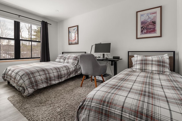 bedroom with wood finished floors