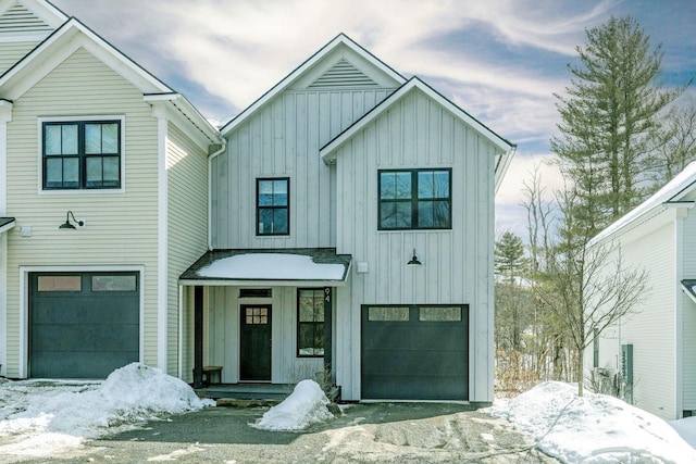 modern farmhouse style home featuring an attached garage and board and batten siding