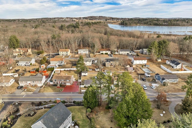 birds eye view of property with a water view and a residential view