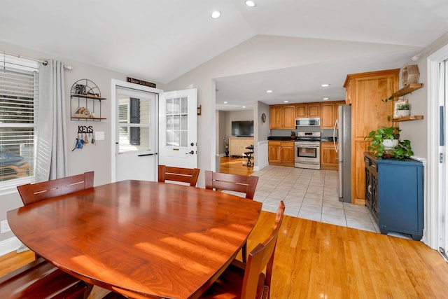 unfurnished dining area with light tile patterned floors, recessed lighting, and vaulted ceiling