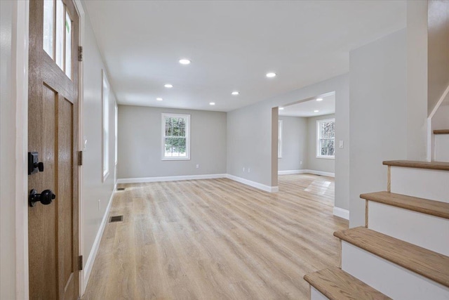 foyer entrance with visible vents, baseboards, stairs, recessed lighting, and light wood-style floors