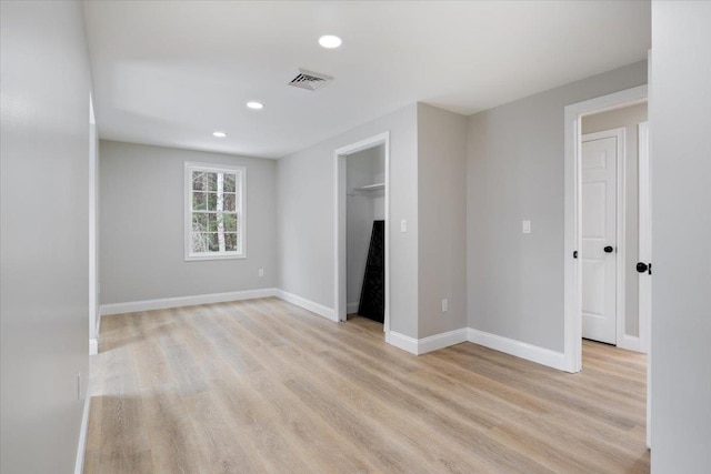 unfurnished bedroom featuring recessed lighting, baseboards, visible vents, and light wood finished floors