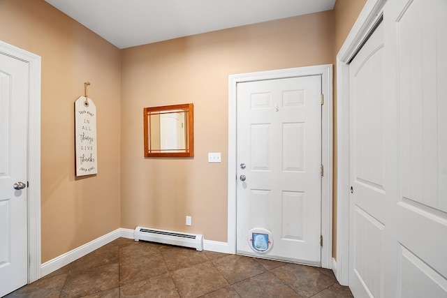 entrance foyer with a baseboard heating unit and baseboards