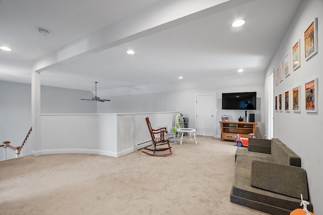 living area featuring ceiling fan, recessed lighting, baseboards, and light carpet