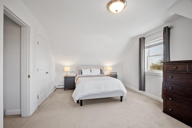 bedroom featuring baseboards, light colored carpet, and vaulted ceiling