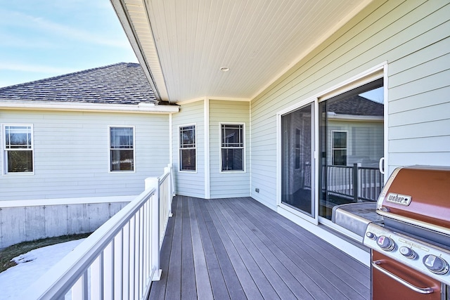 deck featuring a grill