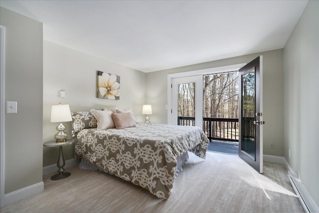 bedroom featuring baseboards, carpet, and access to exterior