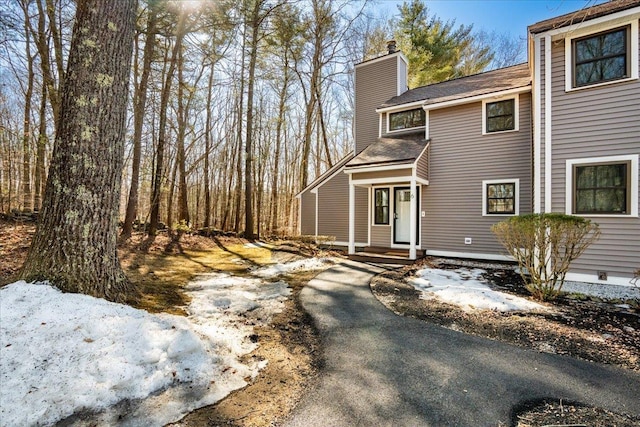 view of side of property featuring a chimney