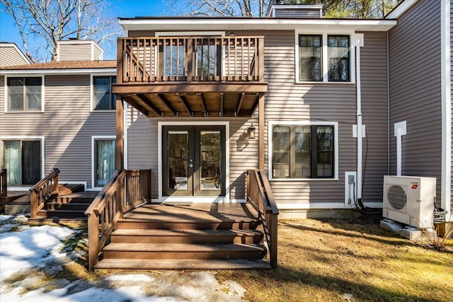 back of house with ac unit, french doors, a deck, and a chimney