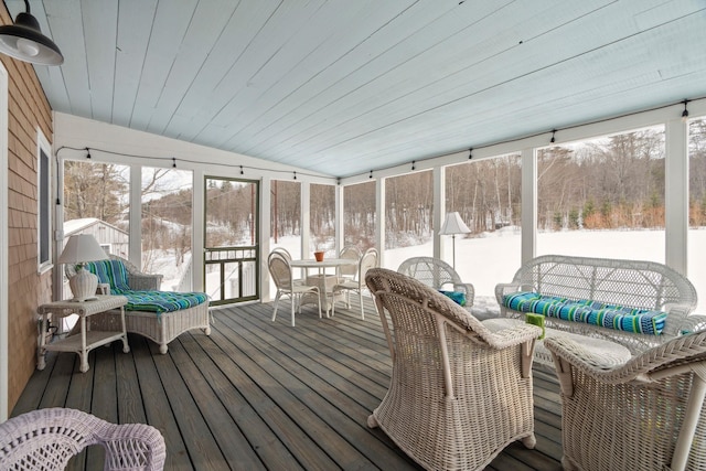 sunroom / solarium with lofted ceiling and wood ceiling