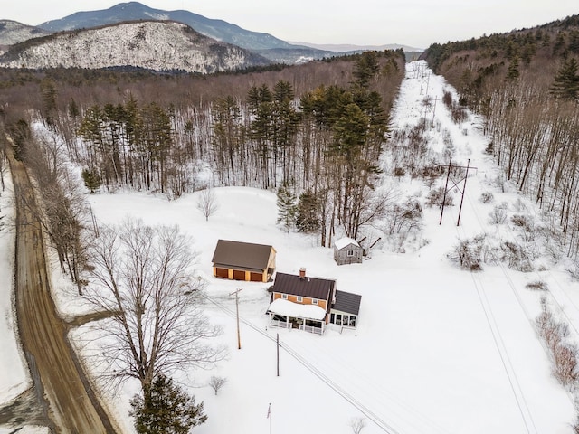 drone / aerial view featuring a mountain view and a forest view