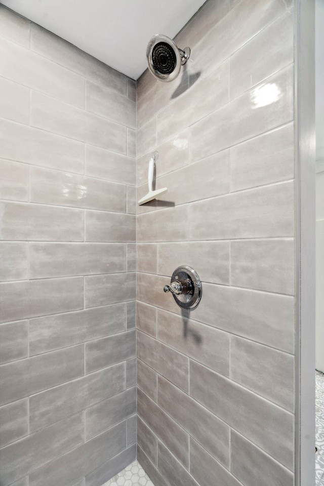 full bathroom with tiled shower