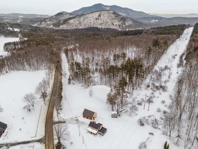 snowy aerial view featuring a mountain view