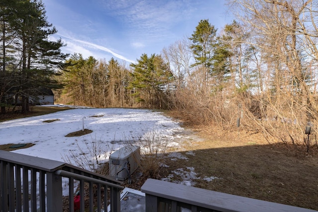 snowy yard with central air condition unit