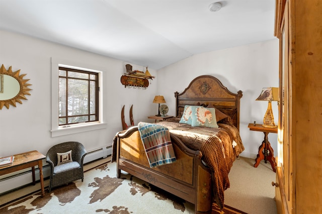 bedroom featuring a baseboard heating unit, lofted ceiling, and carpet