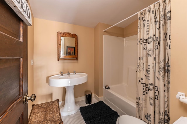 bathroom with tile patterned flooring, shower / bath combination with curtain, toilet, and baseboards