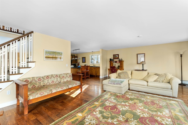 living area with wood finished floors and baseboards