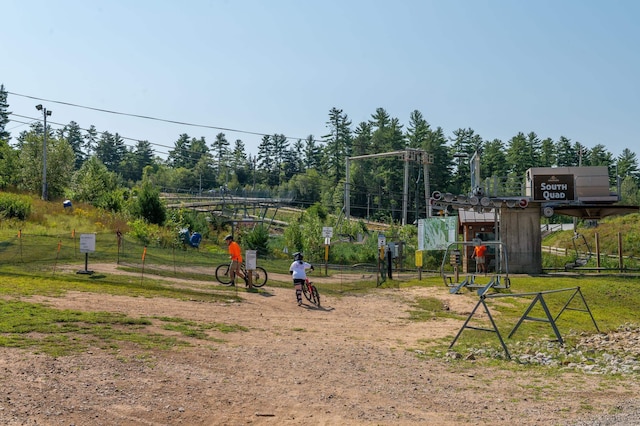 view of home's community with fence