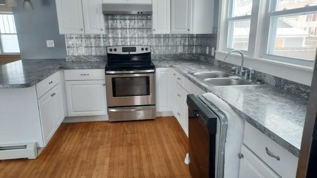 kitchen featuring dishwashing machine, a baseboard radiator, electric range, a sink, and under cabinet range hood