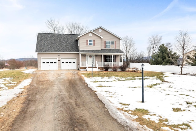 traditional-style house featuring dirt driveway, fence, covered porch, roof with shingles, and an attached garage