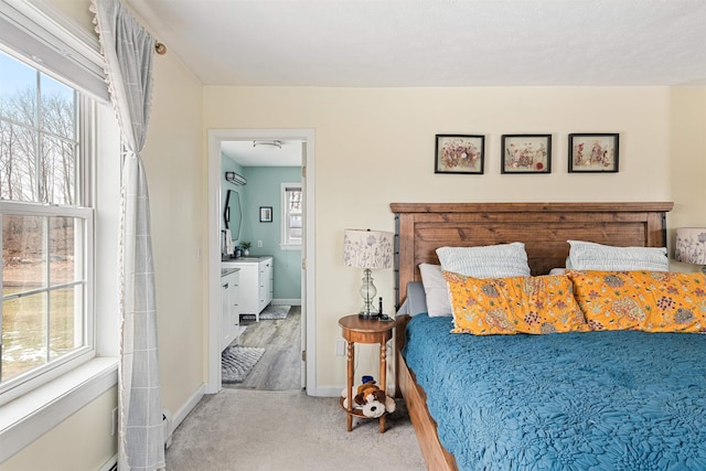 carpeted bedroom featuring baseboards