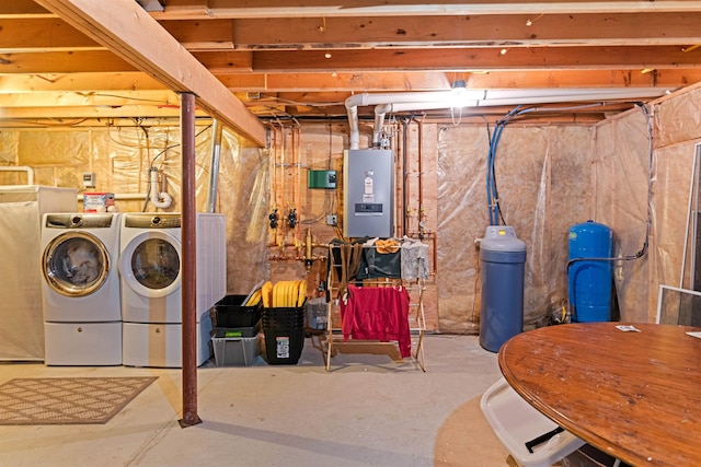 unfinished below grade area with washer and clothes dryer