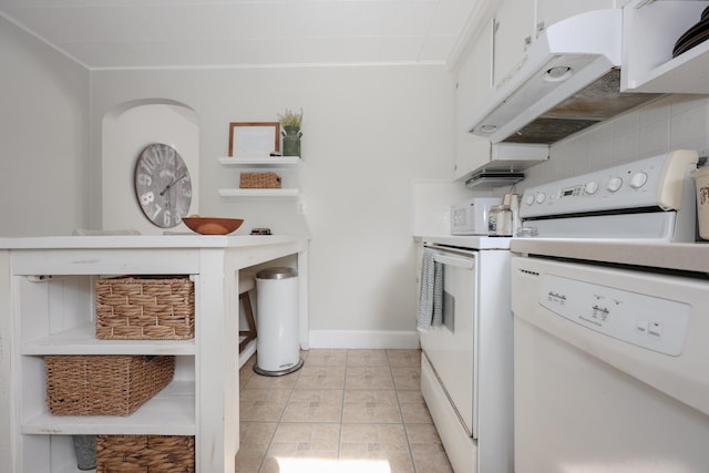 kitchen with electric stove, under cabinet range hood, backsplash, white cabinets, and baseboards