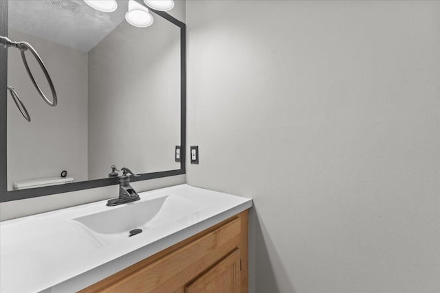 bathroom with vanity and visible vents